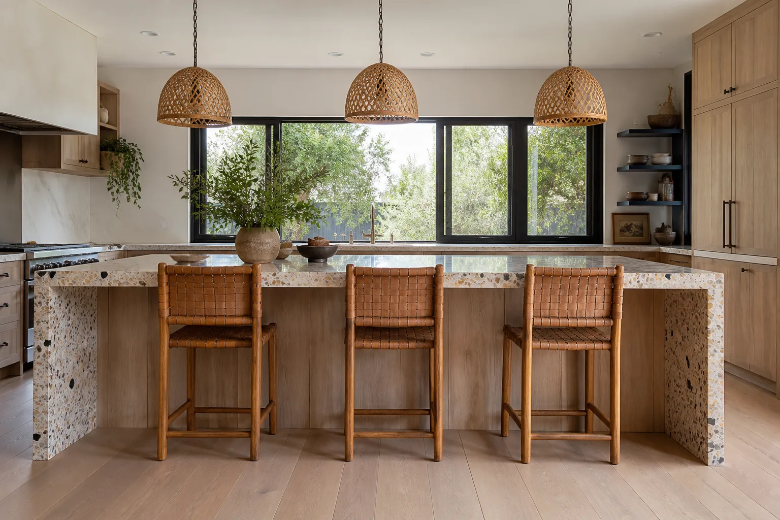 A remodeled kitchen with a waterfall island and wood cabinets